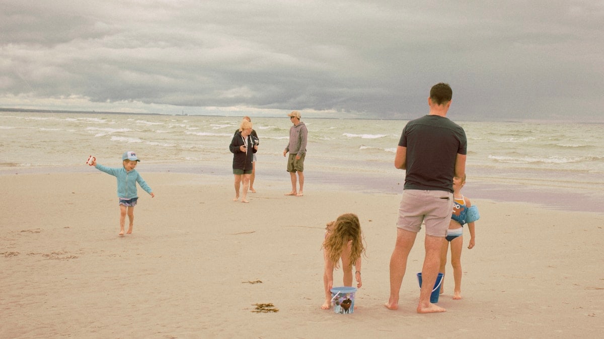 people walking on beach during daytime